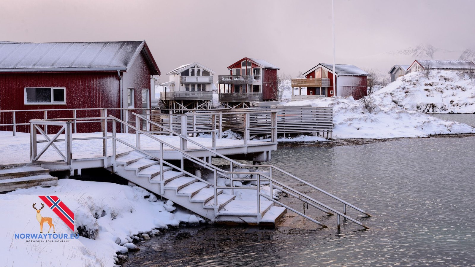 Wooden boat clubs at Sommarøy Island with clear Arctic waters.